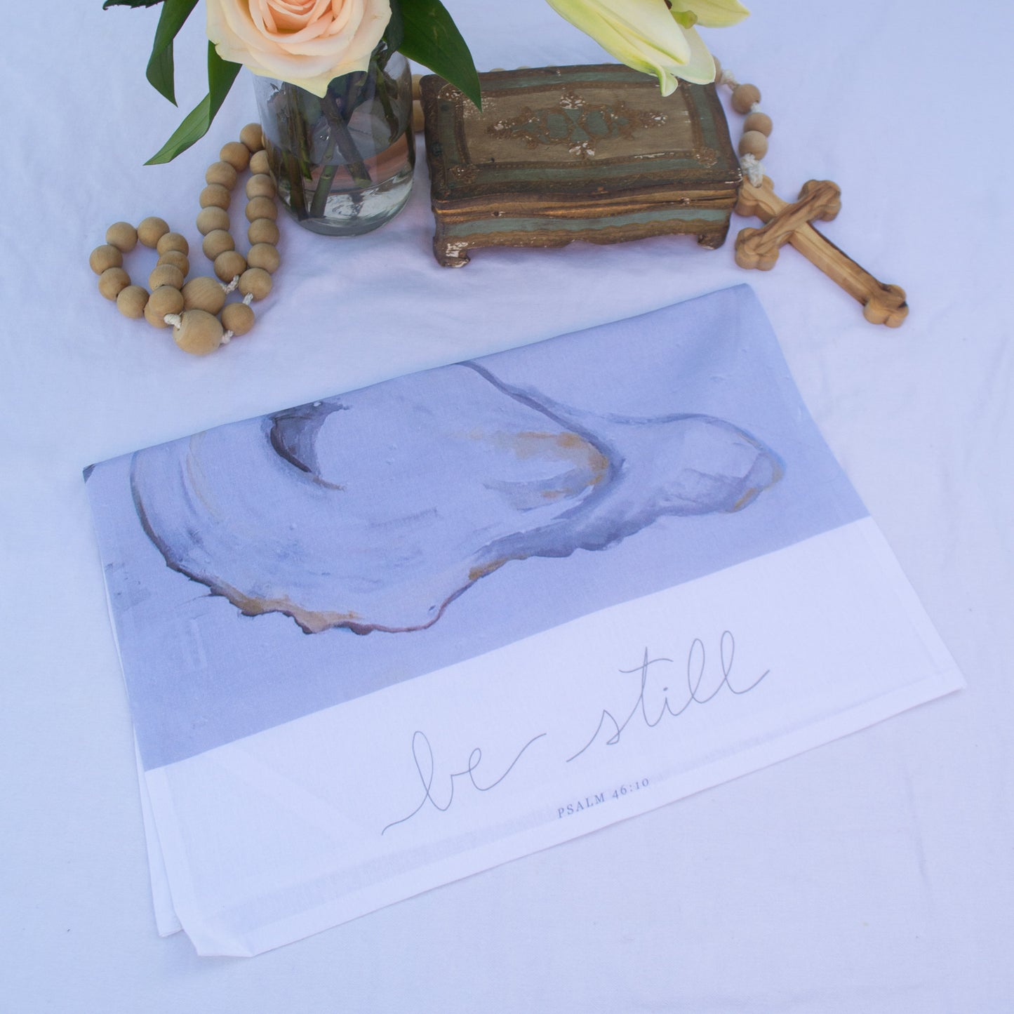 Oyster painting with psalm 46:10 "Be Still" on a tea towel