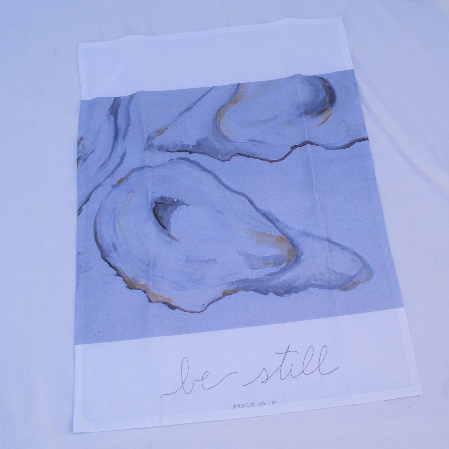 Oyster painting with psalm 46:10 "Be Still" on a tea towel