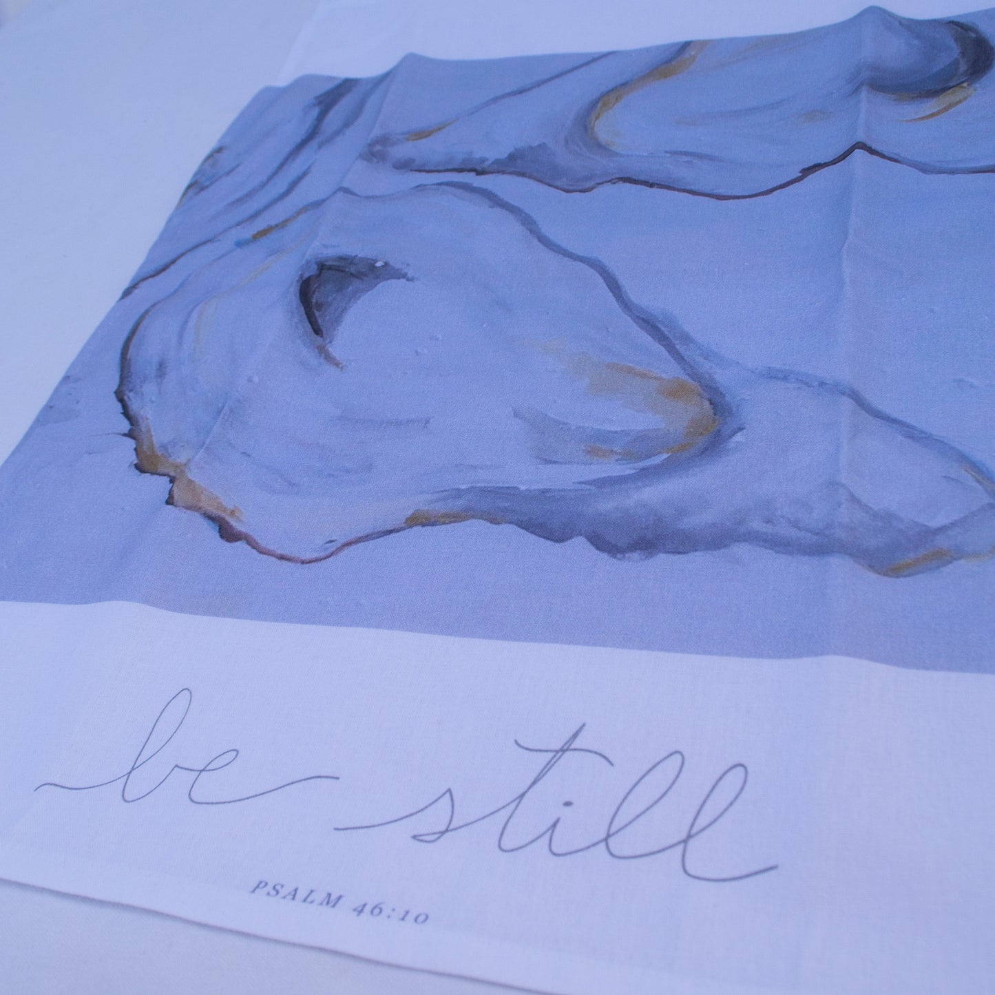 Oyster painting with psalm 46:10 "Be Still" on a tea towel